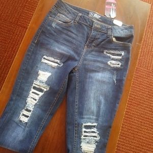 Distressed Mid Rise Skinny Jeans